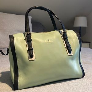 Lightly used mint green Kate Spade satchel bag with white and black interior.